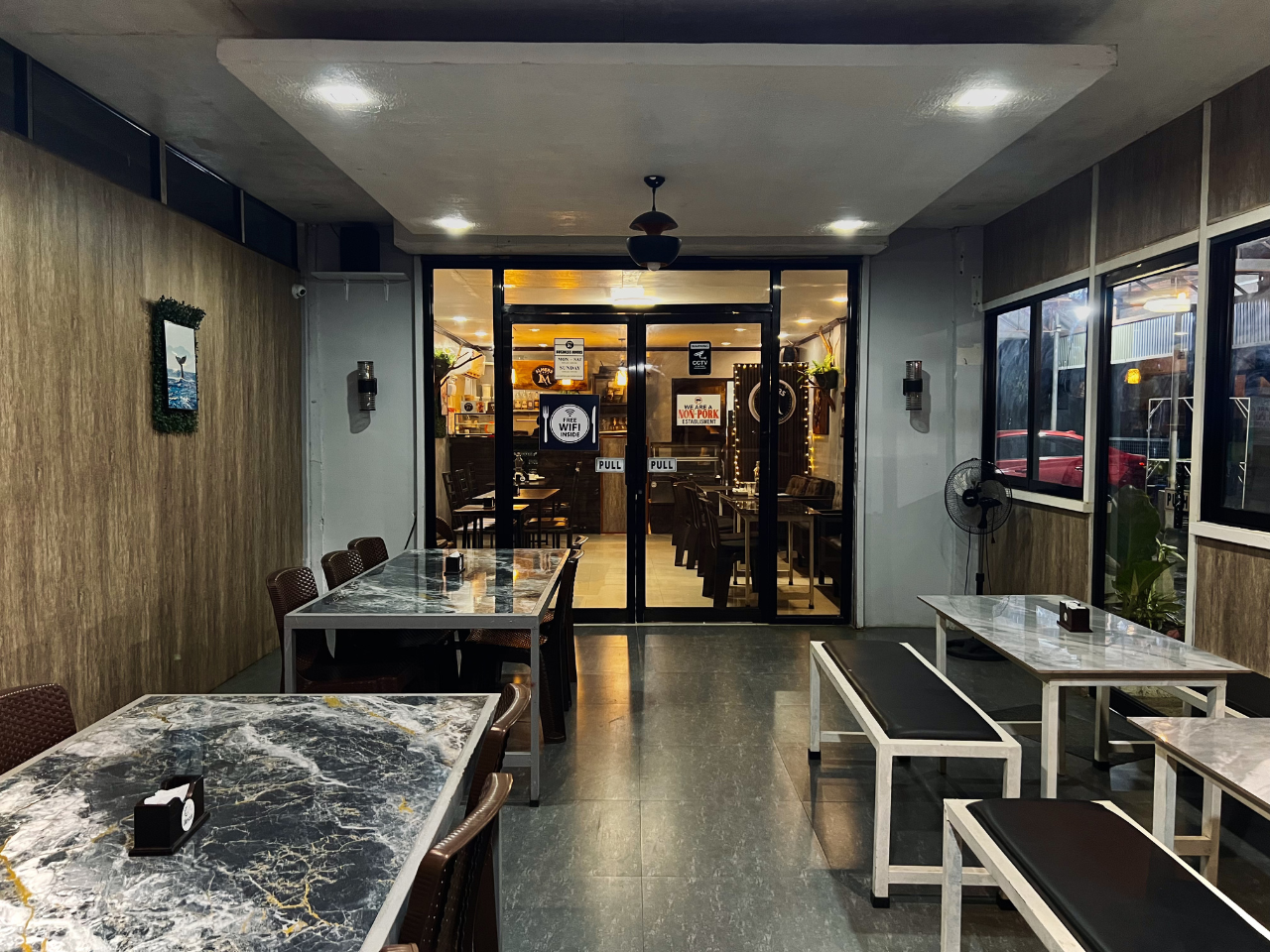 Warm and welcoming dining atmosphere at Almers Cafe in Matalam